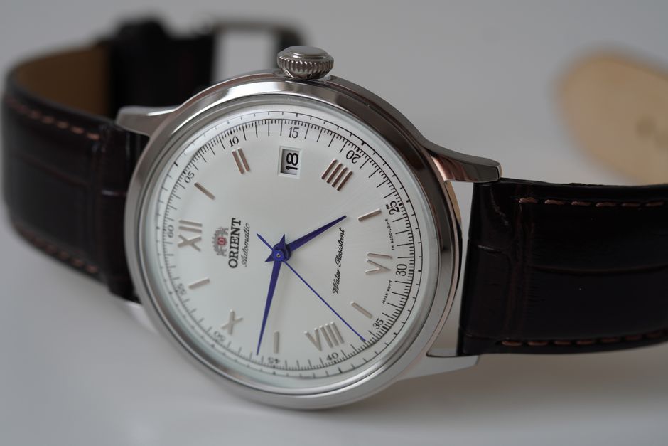 Close-up of a classic wristwatch with Roman numerals and vintage aesthetic.