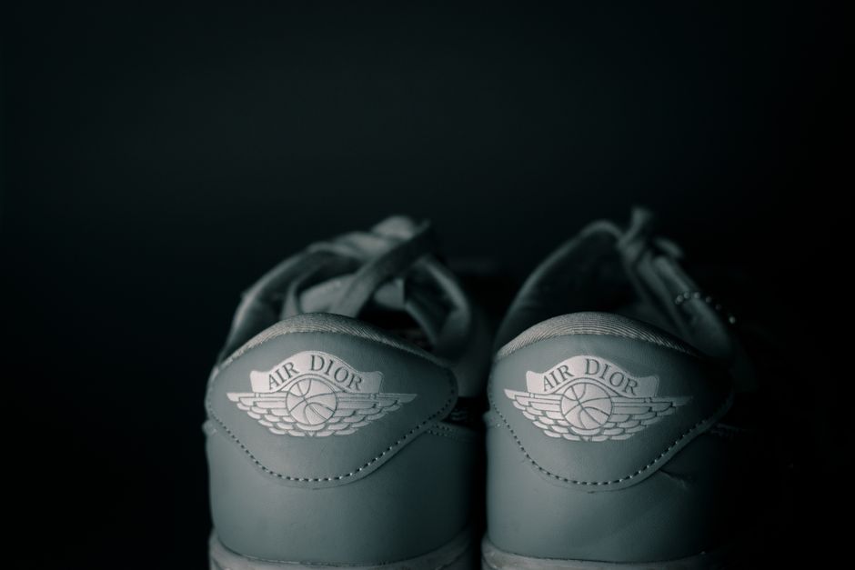 Elegant close-up of Air Dior sneakers, showcasing luxury branding and style.